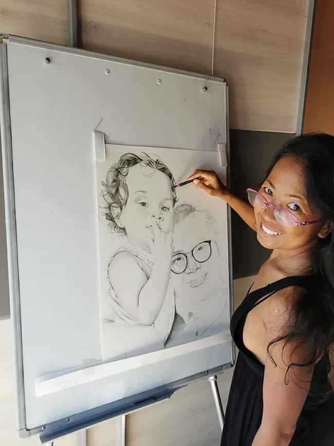 Why Custom Pencil Portraits Make Perfect Gifts april suwichai drawing a custom pencil portrait